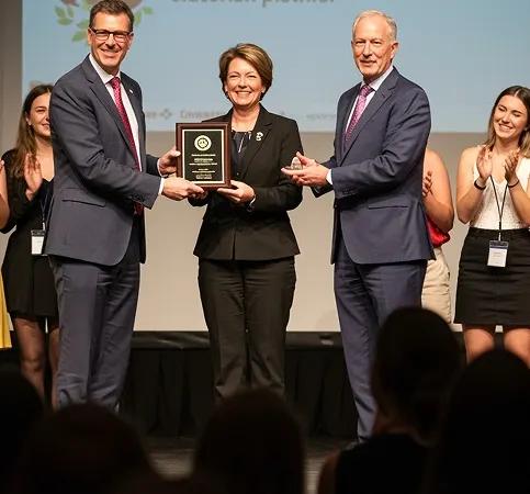 Award presentation at a formal ceremony.